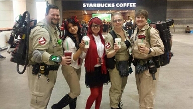 Mya at C2E2 2015, cosplaying as Grell Sutcliff from  Black Butler, with a crew of Ghostbusters & a classmate dressed as a cat who's trying to purloin Mya's coffee